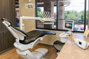 dental office operatory photo with chair, monitor and instruments