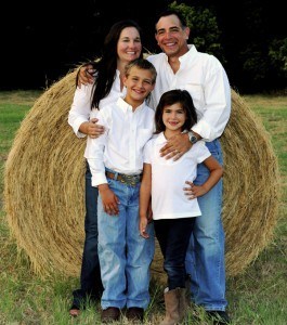 Kevin M. Altieri, DDS with his family in front of a giant hay bale